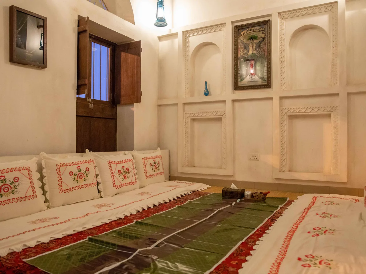 The Al Ain branch: a majlis room with floor seating and embroidered cushions
