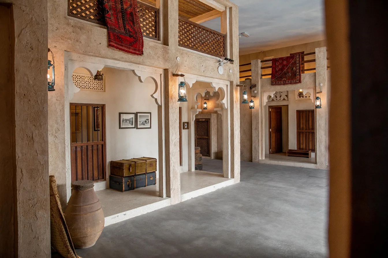A hallway with arches and carved wooden doors